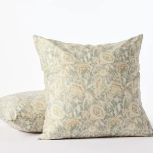 Coyuchi Balboa Print decorative pillow in sage green with champagne floral pattern, two sizes shown.