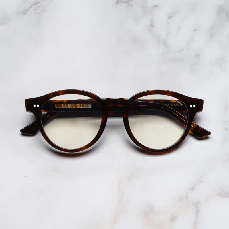 An image of the 1378 Blue Light Filter Optical Round Glasses (Small) in Dark Turtle frame frontal view with arms closed marble background