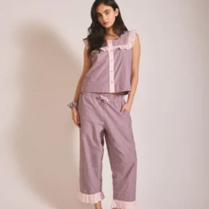 Portrait shot of model wearing TBCo Cropped Cotton Pyjamas in Burgundy Stripe Ruffle in gallery position 1