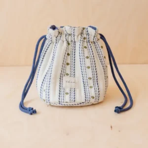 Cotton Wash Bag in Navy Ditsy Floral by TBCo, 100% cotton quilted drawstring bag with floral stripes, compact and structured.