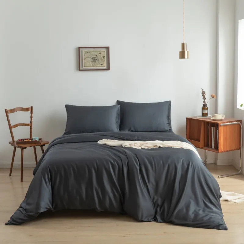 Space Blue bamboo bedding set styled on a bed in a bedroom setting
