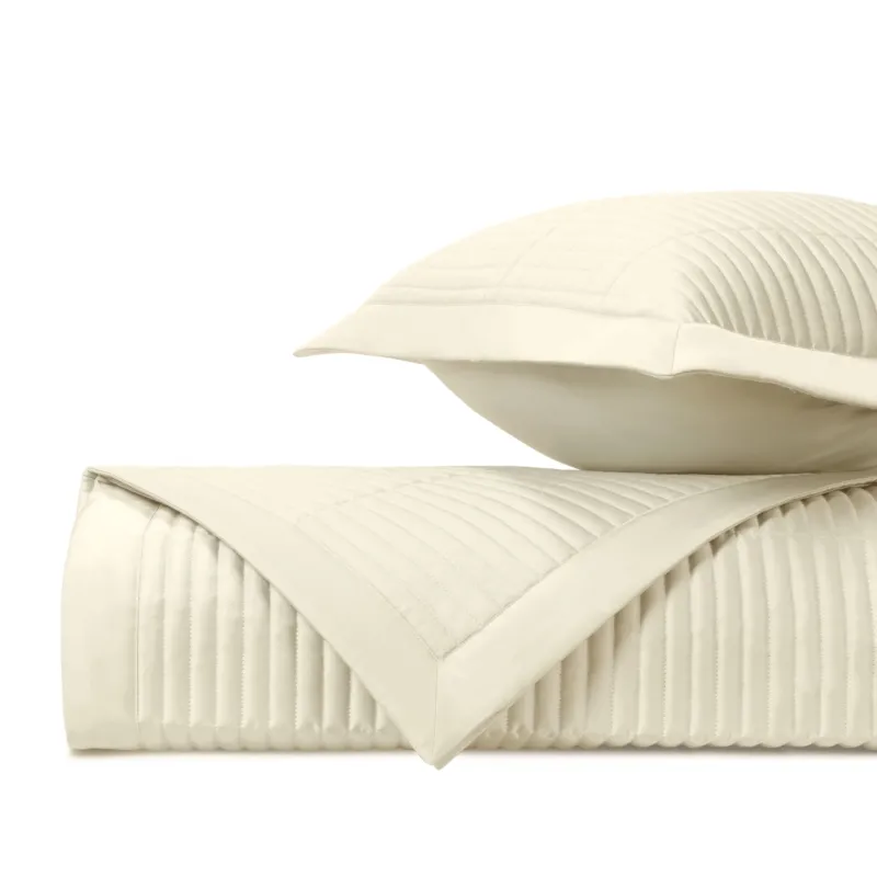 Home Treasures Channel ivory quilted coverlet and euro sham with parallel channel stitching.