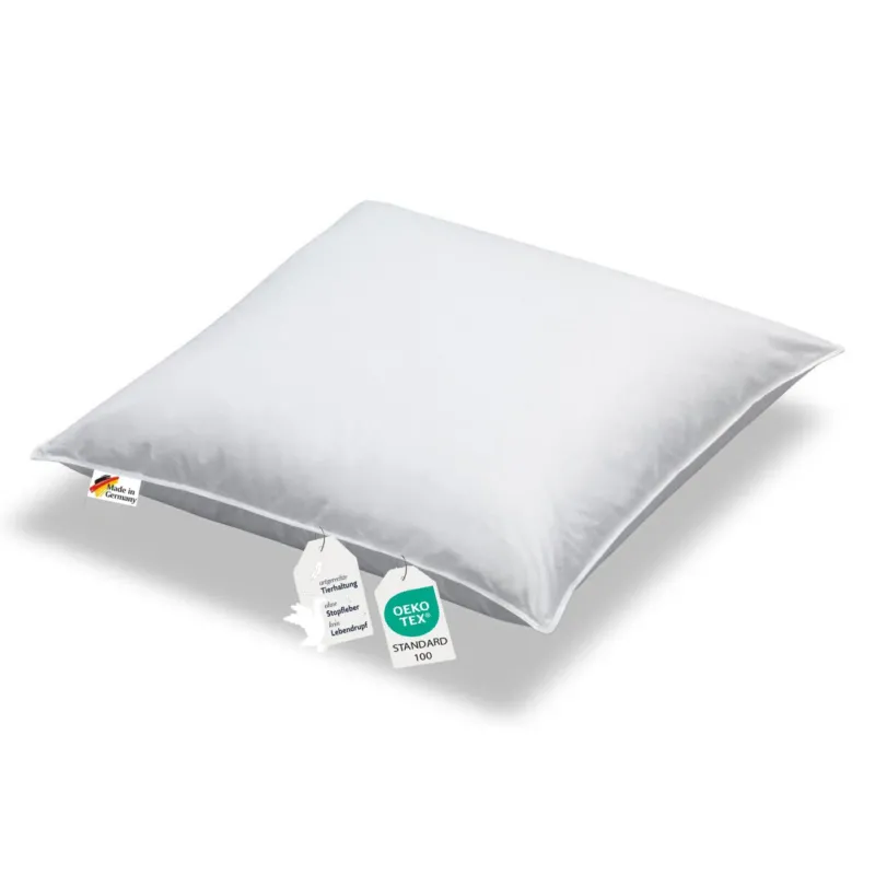 Ein Kopfkissen in weiß gefüllt mit Daunen Oekotex Label